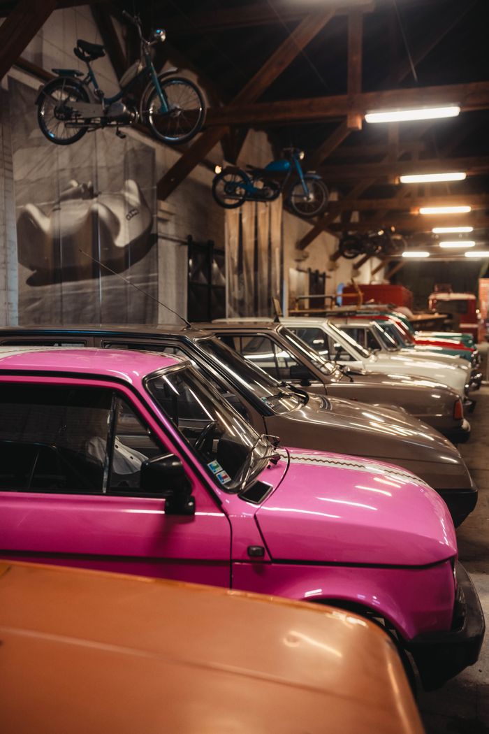 A captivating display of classic cars in an indoor museum with vintage decor.
